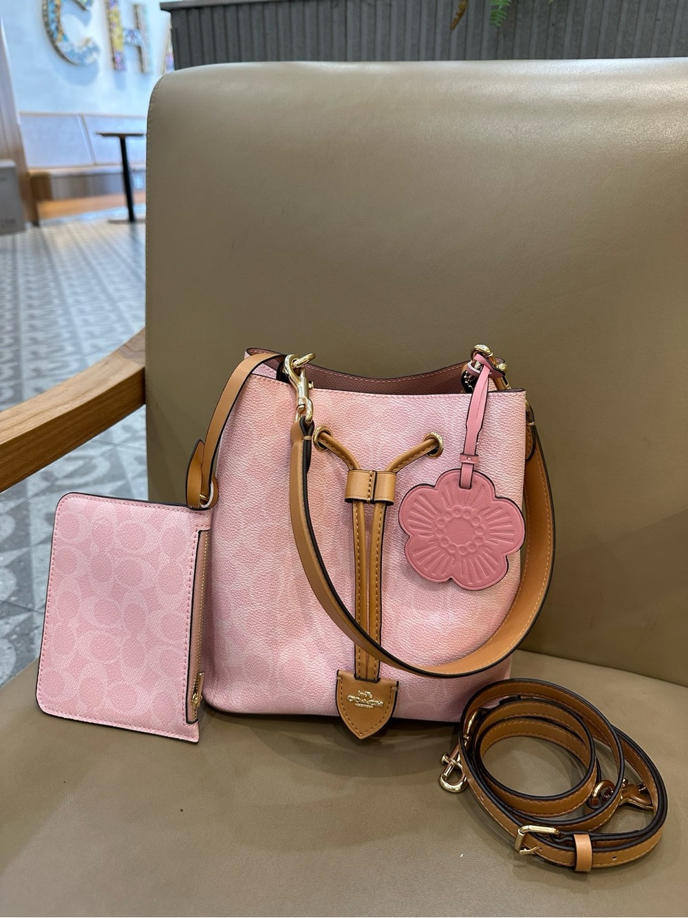 Coach Pink Pebble Leather Drawstring Bucket Bag with Tan Trim and Floral Charm - Picture 1 of 9